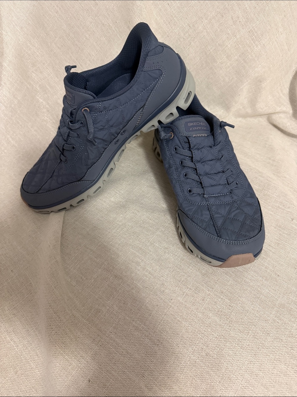 Skechers Quilted Slip-On Sneakers in Navy with Gray Sole